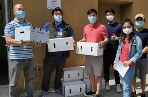 Group of 6 people wearing masks.