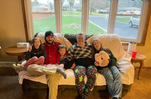 White family 2 adults and 3 kids on couch